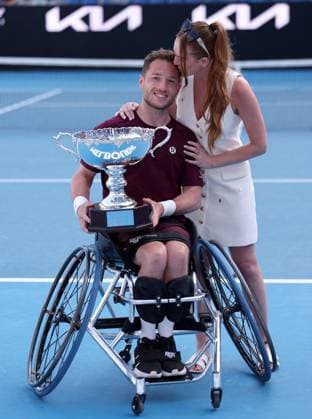 Alfie Hewett of GB kisses his wife whilst holding the trophy Australian Open, Day Fourteen, Tennis, Melbourne Park, Melbourne, Australia - 25 Jan 2025  Copyright: xEllaxLing Shutterstockx 15108786n