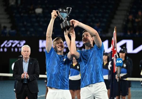 TENNIS AUSTRALIAN OPEN, Harri Heliovaara of Finland (left) and Henry Patten of Great Britain celebrate with their trophy after winning the men s doubles final against Simone Bolelli and Andrea Vavassori of Italy during the 2025 Australian Open at Melbourne Park in Melbourne, Saturday, January 25, 2025. ( NO ARCHIVING, EDITORIAL USE ONLY, NO USE IN BOOKS WITHOUT CONSENT MELBOURNE VICTORIA AUSTRALIA  Copyright: xJAMESxROSSx 20250126113286468679