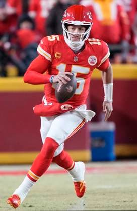 Kansas City Chiefs quarterback Patrick Mahomes (15) rolls out against the Buffalo Bills in the first quarter at Arrowhead Stadium in Kansas City, Missouri, on Sunday, January 26, 2025.  KCP20250126724 JONxROBICHAUD