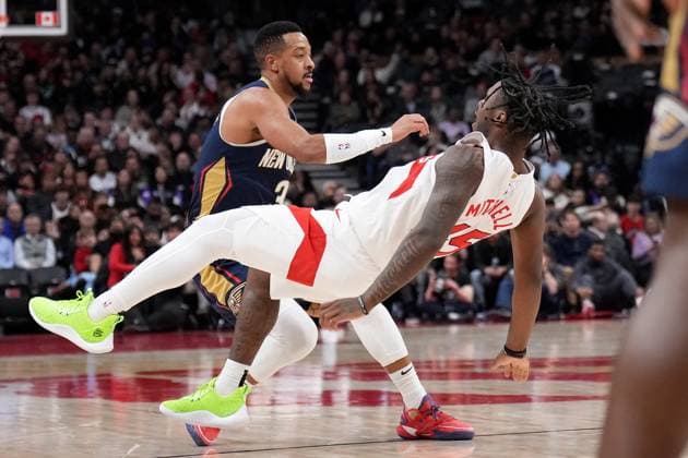 Sport Themen der Woche KW05 Sport Bilder des Tages January 27, 2025, Toronto, On, CANADA: Toronto Raptors guard Davion Mitchell (45) gets knocked down as he fouls New Orleans Pelicans guard CJ McCollum (3) during first half NBA, Basketball Herren, USA basketball action in Toronto on Monday, January 27, 2025. Canada News - January 27, 2025  - ZUMAc35_ 20250127_zaf_c35_120 Copyright: xNathanxDenettex