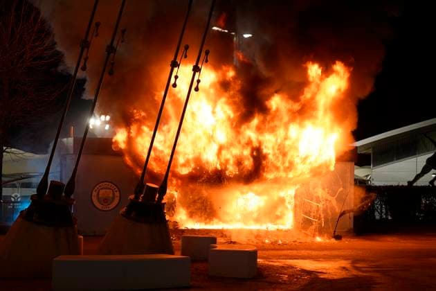 Manchester, England, 29th January 2025. A Manchester City club sho catches fire outside the stadium during the UEFA Champions League match at the Etihad Stadium, Manchester. Picture credit should read: Andrew Yates Sportimage EDITORIAL USE ONLY. No use with unauthorised audio, video, data, fixture lists, club league logos or live services. Online in-match use limited to 120 images, no video emulation. No use in betting, games or single club league player publications. SPI_001_AY_MAN_CITY_BRUGGE SPI-3642-0001