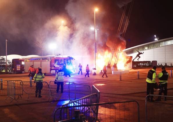 A merchandise stall on fire outside the stadium ahead of the match Manchester City v Club Brugge, UEFA Champions League, Group Stage, Football, Etihad Stadium, Manchester, UK - 29 Jan 2025 EDITORIAL USE ONLY No use with unauthorised audio, video, data, fixture lists, club league logos or live services. Online in-match use limited to 120 images, no video emulation. No use in betting, games or single club league player publications. Copyright: xMattxWest Shutterstockx 15122170i