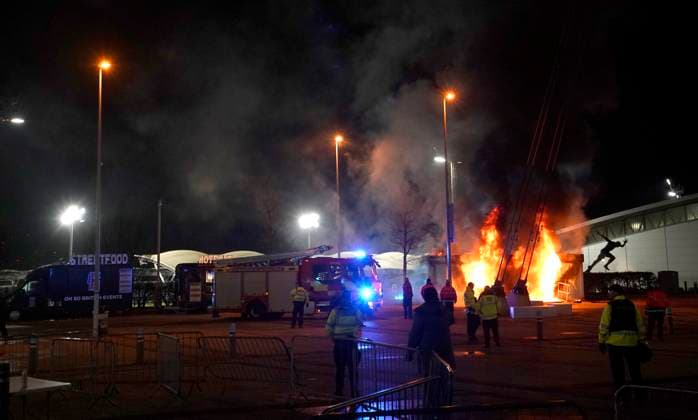 Manchester, England, 29th January 2025. A Manchester City club shop catches fire outside the stadium during the UEFA Champions League match at the Etihad Stadium, Manchester. Picture credit should read: Andrew Yates Sportimage EDITORIAL USE ONLY. No use with unauthorised audio, video, data, fixture lists, club league logos or live services. Online in-match use limited to 120 images, no video emulation. No use in betting, games or single club league player publications. SPI_002_AY_MAN_CITY_BRUGGE SPI-3642-0008