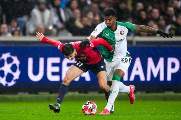 UEFA Champions League: Lille OSC v Feyenoord Lille - Osame Sahraoui of Lille OSC, Jeyland Mitchell of Feyenoord during the eight and final round of new format of the Champions League 2024 2025. The match is set between Lille OSC and Feyenoord at Stade Pierre-Mauroy on 29 January 2025 in Lille, France. Copyright: xTomxBodex