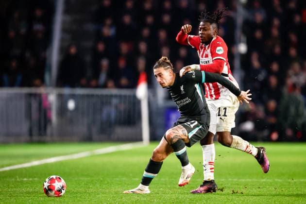 2025-01-29 PSV Eindhoven v Liverpool FC - UEFA Champions League 2024 25 League Phase MD8 EINDHOVEN, NETHERLANDS - JANUARY 29: Konstantinos Tsimikas of Liverpool FC battles for possession with Johan Bakayoko of PSV during the UEFA Champions League 2024 25 League Phase MD8 match between PSV Eindhoven and Liverpool FC at PSV Stadion on January 29, 2025 in Eindhoven, Netherlands. Eindhoven PSV Stadion Netherlands Content not available for redistribution in The Netherlands directly or indirectly through any third parties. Copyright: xBroerxvanxdenxBoomx