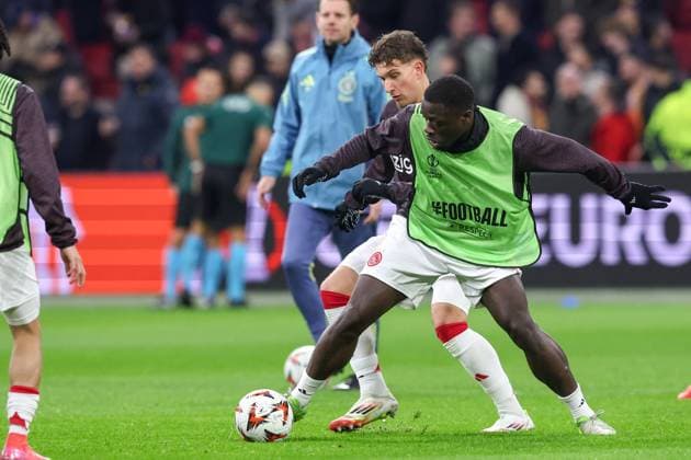 2025-01-30 AFC Ajax v Galatasaray - UEFA Europa League 2024 25 League Phase MD8 AMSTERDAM, NETHERLANDS - JANUARY 30: Mika Godts of AFC Ajax and Brian Brobbey of AFC Ajax warming up prior to the UEFA Europa League 2024 25 League Phase MD8 match between AFC Ajax and Galatasaray at Johan Cruijff ArenA on January 30, 2025 in Amsterdam, Netherlands. Amsterdam Johan Cruijff ArenA Netherlands Content not available for redistribution in The Netherlands directly or indirectly through any third parties. Copyright: xBenxGalx