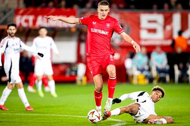 2025-01-30 FC Twente v Besiktas JK - UEFA Europa League 2024 25 League Phase MD8 ENSCHEDE, NETHERLANDS - JANUARY 30: Gustaf Lagerbielke of FC Twente battles for possession with Gedson Fernandes of Besiktas JK during the UEFA Europa League 2024 25 League Phase MD8 match between FC Twente and Besiktas JK at De Grolsch Veste on January 30, 2025 in Enschede, Netherlands. Enschede De Grolsch Veste Netherlands Content not available for redistribution in The Netherlands directly or indirectly through any third parties. Copyright: xPeterxLousx