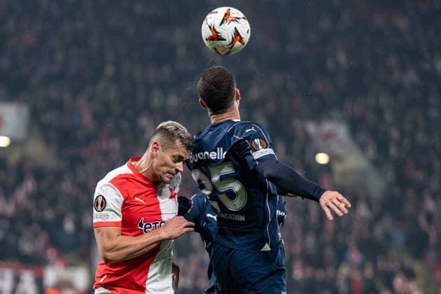Tomas HOles in a header battle during UEFA Europa league match, SK Slavia Prague - Malmo FF , 30. january 2025, Fortuna Arena, Prague, Czech republic Copyright: xMICHALxFAJT,ZOSPORTU.SKx FAJ_2158