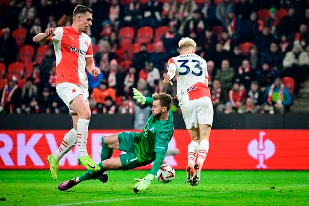 L-R Daniel Fila (Slavia), goalkeeper Ricardo Friedrich (Malmo) and Ondrej Zmrzly (Slavia) in action during the UEFA Europa League, last 8th round match SK Slavia Praha vs Malmo FF, in Prague, Czech Republic, on January 30, 2025. (CTKxPhoto VitxSimanek) CTKPhotoP2025013010476  CTKPhotoP2025013010476