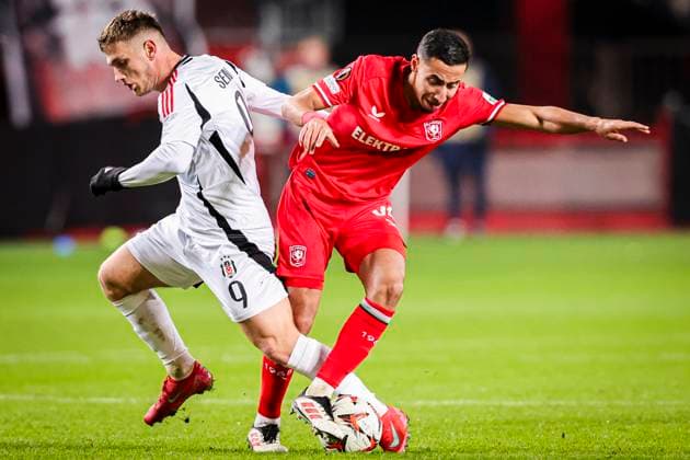 2025-01-30 FC Twente v Besiktas JK - UEFA Europa League 2024 25 League Phase MD8 ENSCHEDE, NETHERLANDS - JANUARY 30: Anass Salah-Eddine of FC Twente battles for possession with Semih Kilicsoy of Besiktas JK during the UEFA Europa League 2024 25 League Phase MD8 match between FC Twente and Besiktas JK at De Grolsch Veste on January 30, 2025 in Enschede, Netherlands. Enschede De Grolsch Veste Netherlands Content not available for redistribution in The Netherlands directly or indirectly through any third parties. Copyright: xPeterxLousx