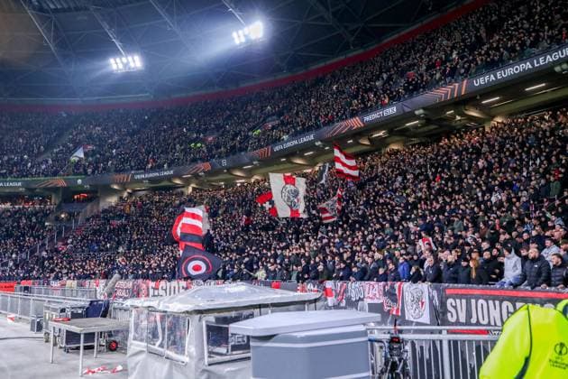 2025-01-30 AFC Ajax v Galatasaray - UEFA Europa League 2024 25 League Phase MD8 AMSTERDAM, NETHERLANDS - JANUARY 30: Fans of Ajax waving flags during the UEFA Europa League 2024 25 League Phase MD8 match between AFC Ajax and Galatasaray at Johan Cruijff ArenA on January 30, 2025 in Amsterdam, Netherlands. Amsterdam Johan Cruijff ArenA Netherlands Content not available for redistribution in The Netherlands directly or indirectly through any third parties. Copyright: xBenxGalx