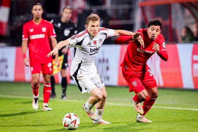 2025-01-30 FC Twente v Besiktas JK - UEFA Europa League 2024 25 League Phase MD8 ENSCHEDE, NETHERLANDS - JANUARY 30: Jonas Svensson of Besiktas JK battles for possession with Sayf Ltaief of FC Twente during the UEFA Europa League 2024 25 League Phase MD8 match between FC Twente and Besiktas JK at De Grolsch Veste on January 30, 2025 in Enschede, Netherlands. Enschede De Grolsch Veste Netherlands Content not available for redistribution in The Netherlands directly or indirectly through any third parties. Copyright: xPeterxLousx