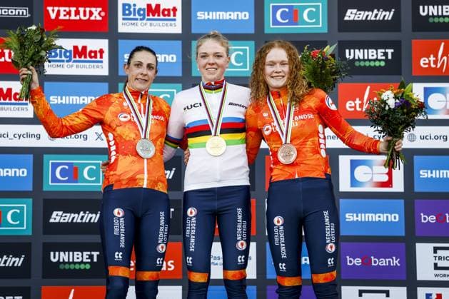 LIEVIN, FRANCE - (l-r) Cyclists Lucinda Brand (second), Fem van Empel (first), Puck Pieterse (third) on the podium after the cyclocross World Cup in Lievin, France. ANP BAS CZERWINSKI xVIxANPxSportx xxANPxIVx 518860287 originalFilename: 518860287.jpg