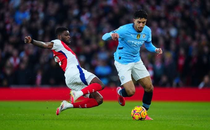 Thomas Partey of Arsenal tackles Omar Marmoush of Manchester City Arsenal v Manchester City, Premier League, Football, Emirates Stadium, London, UK - 02 Feb 2025 EDITORIAL USE ONLY No use with unauthorised audio, video, data, fixture lists, club league logos or live services. Online in-match use limited to 120 images, no video emulation. No use in betting, games or single club league player publications. Copyright: xJavierxGarcia Shutterstockx 15125985gc