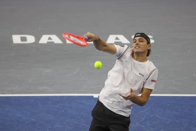 FRISCO, TX - FEBRUARY 05: Taylor Fritz (USA) hits an overhead during the first round of the Dallas Open on February 5, 2025, at Ford Center at The Star in Frisco, TX. (Photo by George Walker Icon Sportswire) TENNIS: FEB 05 Dallas Open EDITORIAL USE ONLY Icon25020590