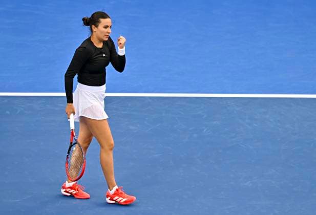(250210) -- DOHA, Feb. 10, 2025 -- Elena-Gabriela Ruse of Romania celebrates a point during women s singles round of 64 match between Elena-Gabriela Ruse of Romania and Maria Sakkari of Greece at the WTA, Tennis Damen Qatar Open tennis tournament in Doha, Qatar, Feb. 9, 2025. (Photo by Xinhua) (SP)QATAR-DOHA-TENNIS-WTA-QATAR OPEN Nikku 