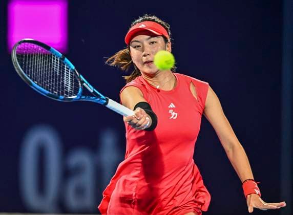 (250210) -- DOHA, Feb. 10, 2025 -- Wang Xinyu of China hits a return during the first round match against Elina Avanesyan of Armenia at WTA, Tennis Damen Qatar Open tennis tournament in Doha, Qatar, Feb. 9, 2025. (Photo by Xinhua) (SP)QATAR-DOHA-TENNIS-WTA-QATAR OPEN Nikku 