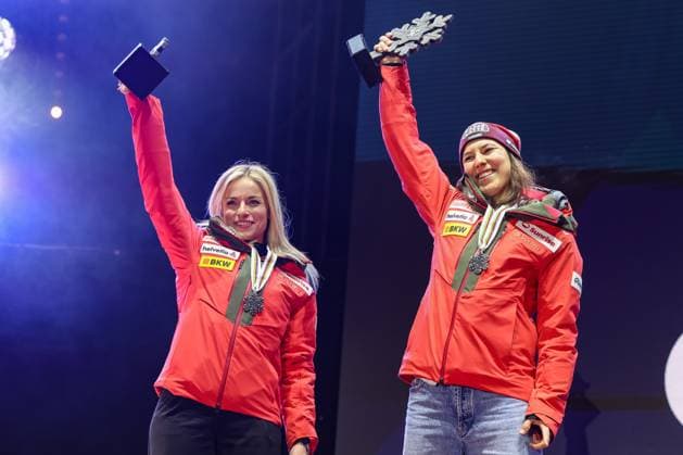 ALPINE SKIING - FIS Ski WC Saalbach 2025 SAALBACH,AUSTRIA,11.FEB.25 - ALPINE SKIING - FIS Alpine World Ski Championships Saalbach 2025, team combined, ladies, medal plaza, award ceremony. Image shows the rejoicing of Lara Gut-Behrami and Wendy Holdener (SUI). Keywords: medal, trophy.  GEPAxpictures xHaraldxSteiner