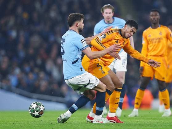 Jude Bellingham of Real Madrid and Ruben Dias of Manchester City Manchester City v Real Madrid, UEFA Champions League, Knockout Round Play-offs, First Leg, Football, Etihad Stadium, Manchester, UK - 11 Feb 2025 EDITORIAL USE ONLY No use with unauthorised audio, video, data, fixture lists, club league logos or live services. Online in-match use limited to 120 images, no video emulation. No use in betting, games or single club league player publications. Copyright: xJavierxGarcia Shutterstockx 15136820w
