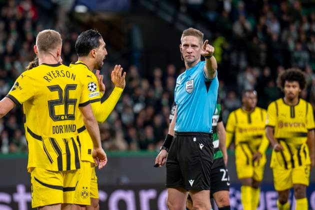 11.02.2025, Fussball: UEFA Champions League, Saison 2024 2025, Play Offs, Hinspiel, Sporting CP Lissabon - Borussia Dortmuna im Estadio Jose Alvalade in Lissabon. Dortmunds Emre Can spricht mit Schiedsrichter Espen Eskas. Foto: Kirchner-Media Thomas Haesler WICHTIGER HINWEIS: Gemäß den Vorgaben der UEFA ist es untersagt, in dem Stadion und oder vom Spiel angefertigte Fotoaufnahmen in Form von Sequenzbildern und oder videoähnlichen Fotostrecken zu verwerten bzw. verwerten zu lassen. Copyright: xKirchner-Media ThomasxHaeslerx