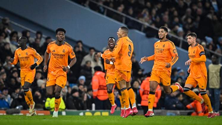 11th February 2025; Etihad Stadium, Manchester, England; UEFA Champions League Play Off Round 1 Football, Manchester City versus Real Madrid; Kylian Mbappe of Real Madrid celebrates with his team after scoring in the 60th minute for 1-1  ActionPlus12749786 GodfreyxPitt
