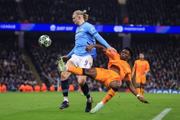 Football - UEFA Champions League - Knockout Play-Off (1st Leg) - Manchester City v Real Madrid 11th February 2025 - UEFA Champions League - Knockout Play-Off (1st Leg) - Manchester City v Real Madrid - Erling Haaland of Manchester City is tackled by Aurelien Tchouameni of Real Madrid - Photo: Simon Stacpoole Offside. Manchester UK Copyright: xSimonxStacpoolexOffside