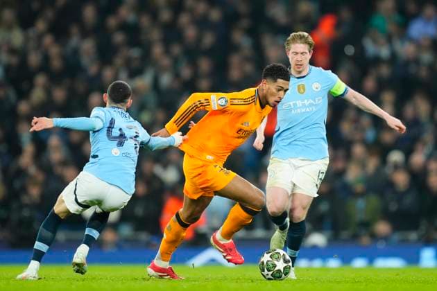 Manchester City v Real Madrid C.F. - UEFA Champions League 2024 25 League Knockout Play-off First Leg Jude Bellingham central midfield of Real Madrid and England and Phil Foden right winger of Manchester City and England compete for the ball during the UEFA Champions League 2024 25 League Knockout Play-off first leg match between Manchester City and Real Madrid C.F. at Manchester City Stadium on February 11, 2025 in Manchester, United Kingdom. Manchester England United Kingdom  Copyright: xJosexBretonx originalFilename:bretonhernandez-manchest250211_nptFH.jpg