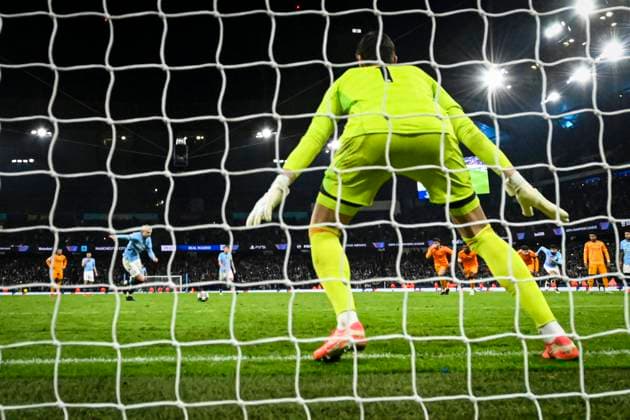 11th February 2025; Etihad Stadium, Manchester, England; UEFA Champions League Play Off Round 1 Football, Manchester City versus Real Madrid; Erling Haaland of Manchester City scores past Thibaut Courtois of Real Madrid from the penalty spot in the 80th minute for 2-1  ActionPlus12749844 GodfreyxPitt