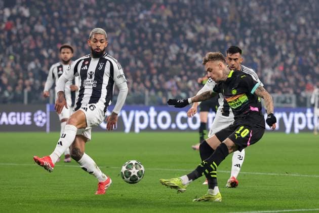 Turin, Italy, 11th February 2025. Douglas Luiz of Juventus attempts to block as cross from Noa Lang of PSV Eindhoven as Nico Gonzalez of Juventus looks on during the UEFA Champions League match at Allianz Stadium, Turin. Picture credit should read: Jonathan Moscrop Sportimage EDITORIAL USE ONLY. No use with unauthorised audio, video, data, fixture lists, club league logos or live services. Online in-match use limited to 120 images, no video emulation. No use in betting, games or single club league player publications. SPI_074_JM_JUVE_PSV_UCL SPI-3661-0080