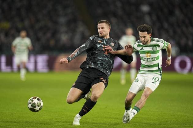 Eric Dier of Bayern Munich and Nicolas Kuhn of Celtic compete for the ball Celtic v Bayern Munich, UEFA Champions League, Knockout Round Play-offs, First Leg, Football, Celtic Park, Glasgow, UK - 12 Feb 2025 EDITORIAL USE ONLY No use with unauthorised audio, video, data, fixture lists, club league logos or live services. Online in-match use limited to 120 images, no video emulation. No use in betting, games or single club league player publications. Copyright: xStuartxWallace Shutterstockx 15136907cb