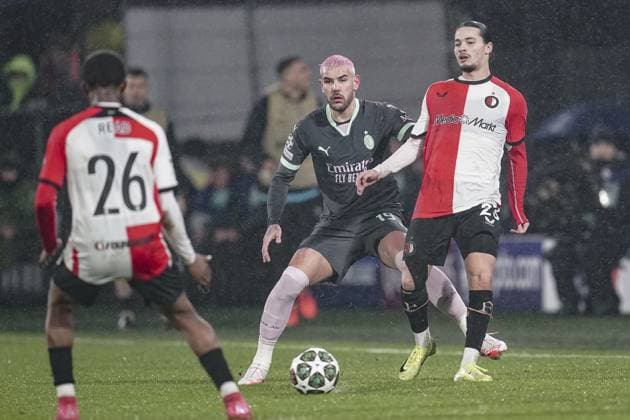 ROTTERDAM, 12-02-2025 , Stadium Feijenoord de Kuip , UEFA Champions League Knockout phase play-offs season 2024 2025 , match between Feyenoord and AC Milan , AC Milan player Theo Hernandez and Feyenoord player Anis Hadj-Moussa Feyenoord - AC Milan  x27830924x Copyright: