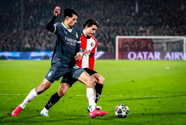 AC Milan midfielder Tijjani Reijnders, Feyenoord Rotterdam defender Hugo Bueno during the match Feyenoord - AC Milan at the Stadium De Kuip for the UEFA Champions League- Knockout phase play- offs1st leg season 2024-2025 in ROTTERDAM, Netherlands on 12 february 2025, (photo by Marcel van Dorst EYE4images DeFodi Images) Defodi-746_215422
