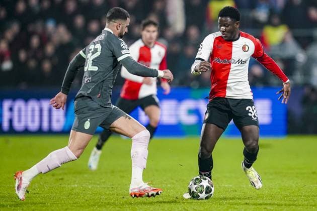 ROTTERDAM, 12-02-2025 , Stadium Feijenoord de Kuip , UEFA Champions League Knockout phase play-offs season 2024 2025 , match between Feyenoord and AC Milan , Feyenoord player Ibrahim Osman and AC Milan player Kyle Walker Feyenoord - AC Milan  x27833294x Copyright: