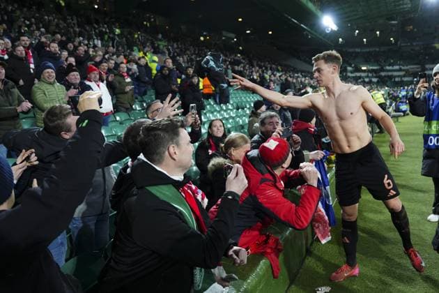 Joshua Kimmich of Bayern Munich throws his jersey into the crowd Celtic v Bayern Munich, UEFA Champions League, Knockout Round Play-offs, First Leg, Football, Celtic Park, Glasgow, UK - 12 Feb 2025 EDITORIAL USE ONLY No use with unauthorised audio, video, data, fixture lists, club league logos or live services. Online in-match use limited to 120 images, no video emulation. No use in betting, games or single club league player publications. Copyright: xStuartxWallace Shutterstockx 15136907fv