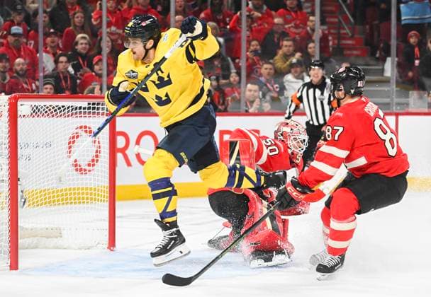 February 12, 2025, Montreal, Pq, Canada: Sweden s William Nylander (88) leaps over Canada goaltender Jordan Binnington (50) as Canada s Sidney Crosby (87) defends during overtime 4 Nations Face-Off hockey action in Montreal, Wednesday, February 12, 2025. William Nylander, Jordan Binnington, Sidney Crosby, - ZUMAc35_ 20250212_zaf_c35_147 Copyright: xGrahamxHughesx