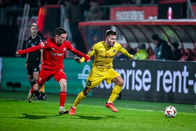 FC Twente forward Daan Rots, Bodo Glimt defender Frederik Andre Bjorkan, during the match Twente - Bodo Glimt at the Grolsch Veste, FC Twente Stadion for the UEFA Europa League - Knockout phase play-offs - 1st leg season 2024-2025 in ENSCHEDE, Netherlands on 13 februari 2025, (photo by Stefan Koops EYE4images DeFodi Images) Defodi-746_215867