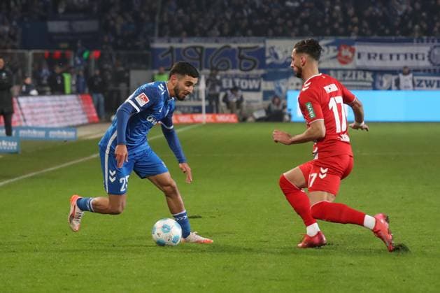 14.02.2025, xgox, Fussball 2. Bundesliga, 1. FC Magdeburg - 1. FC Koeln emspor, v.l. Livian Burcu (Magdeburg, 29), Dejan Ljubicic (Koeln, 7) (DFL DFB REGULATIONS PROHIBIT ANY USE OF PHOTOGRAPHS as IMAGE SEQUENCES and or QUASI-VIDEO) Magdeburg