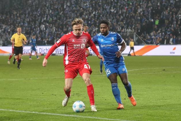 14.02.2025, xgox, Fussball 2. Bundesliga, 1. FC Magdeburg - 1. FC Koeln emspor, v.l. Mathias Olsen (Koeln, 47), Daniel Heber (Magdeburg, 15) (DFL DFB REGULATIONS PROHIBIT ANY USE OF PHOTOGRAPHS as IMAGE SEQUENCES and or QUASI-VIDEO) Magdeburg