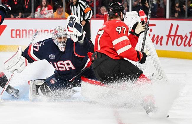 Eishockey, 4 Nations Face-Off in Montreal, Kanada - USA February 15, 2025, Montreal, Pq, Canada: Canada s Connor McDavid (97) scores on United States goaltender Connor Hellebuyck (37) during first period 4 Nations Face-Off hockey action in Montreal, Saturday, February 15, 2025. Connor Hellebuyck, Connor McDavid, - ZUMAc35_ 20250215_zaf_c35_219 Copyright: xGrahamxHughesx