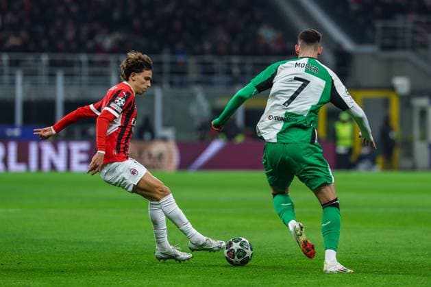 Joao Felix Sequeira of AC Milan competes for the ball with Jakub Moder of Feyenoord Rotterdam during UEFA Champions League 2024 25 Knockout phase play-offs 2nd leg football match between AC Milan and Feyenoord Rotterdam at San Siro Stadium  Copyright: xFabrizioxCarabelli IPAxSportx xipa-agency.netx xx IPA_54259390 IPA_Agency_IPA54259390