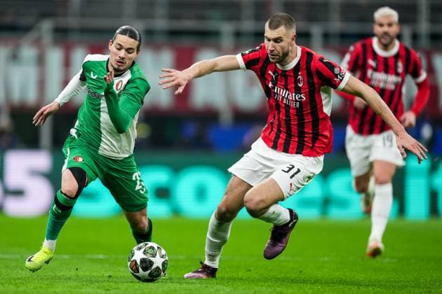 UEFA Champions League: AC Milan v Feyenoord Milan - Anis Hadj Moussa of Feyenoord, Strahinja Pavlovic of AC Milan during the 2nd leg of the knockout phase play-offs of new format of the Champions League 2024 2025. The match is set between AC Milan and Feyenoord at Giuseppe Meazza San Siro on 18 February 2025 in Milan, Italy. Copyright: xTomxBodex