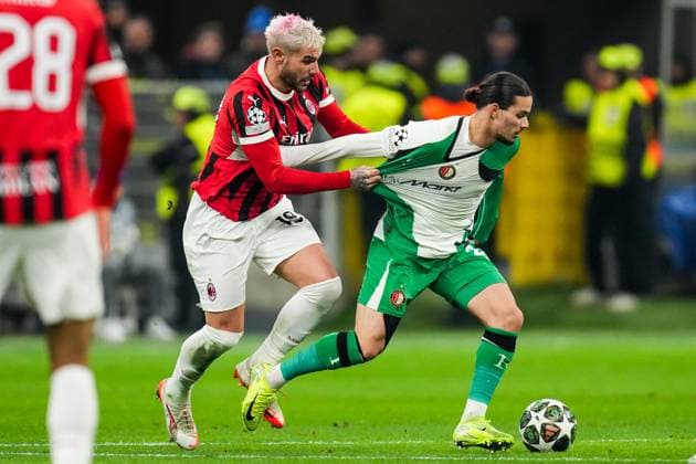 UEFA Champions League: AC Milan v Feyenoord Milan - Theo Hernandez of AC Milan, Anis Hadj Moussa of Feyenoord during the 2nd leg of the knockout phase play-offs of new format of the Champions League 2024 2025. The match is set between AC Milan and Feyenoord at Giuseppe Meazza San Siro on 18 February 2025 in Milan, Italy. Copyright: xYannickxVerhoevenx