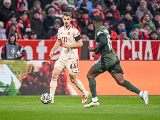 Josip Stanisic (FC Bayern Muenchen) und Jeffrey Schlupp (Celtic FC) battle for the ball during the UEFA Champions League 2024 25 League Knockout Play-off Second Leg match between FC Bayern München and Celtic FC at Allianz Arena on February 18, 2025 in Munich, Germany. (Photo by Harry Langer DeFodi Images) Defodi-541_FCBCFC0250218_13