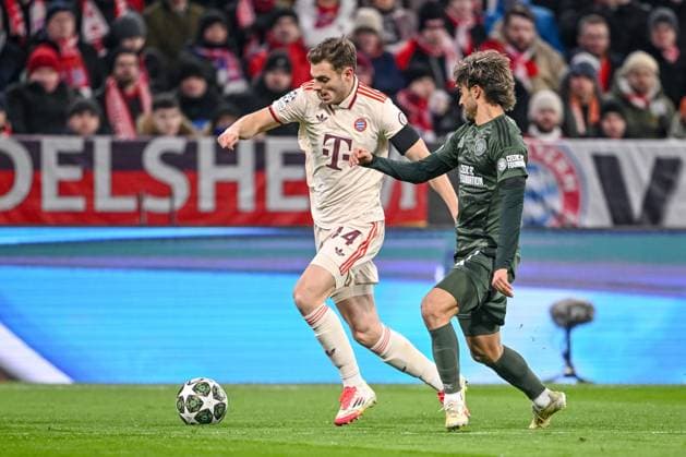 Josip Stanisic (FC Bayern Muenchen) und Jota (Celtic FC) battle for the ball during the UEFA Champions League 2024 25 League Knockout Play-off Second Leg match between FC Bayern München and Celtic FC at Allianz Arena on February 18, 2025 in Munich, Germany. (Photo by Harry Langer DeFodi Images) Defodi-541_FCBCFC0250218_17