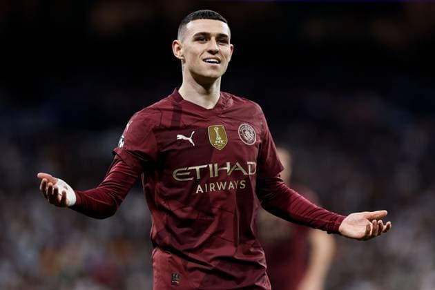 Phil Foden of Manchester City appeals Real Madrid v Manchester City, UEFA Champions League, Knockout Round Play-offs, Second Leg, Football, Santiago BernaboÆ?Ã?Æ?o Ã? u, Madrid, Spain - 19 Feb 2025 EDITORIAL USE ONLY No use with unauthorised audio, video, data, fixture lists, club league logos or live services. Online in-match use limited to 120 images, no video emulation. No use in betting, games or single club league player publications.  Copyright: xRubenxAlbarran Shutterstockx 15137179y