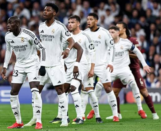 Ferland Mendy of Real Madrid (L) Real Madrid v Manchester City, UEFA Champions League, Knockout Round Play-offs, Second Leg, Football, Santiago BernaboÆ?Ã?Æ?o Ã? u, Madrid, Spain - 19 Feb 2025 EDITORIAL USE ONLY No use with unauthorised audio, video, data, fixture lists, club league logos or live services. Online in-match use limited to 120 images, no video emulation. No use in betting, games or single club league player publications.  Copyright: xRubenxAlbarran Shutterstockx 15137179ab