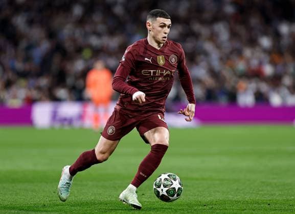 Phil Foden of Manchester City Real Madrid v Manchester City, UEFA Champions League, Knockout Round Play-offs, Second Leg, Football, Santiago BernaboÆ?Ã?Æ?o Ã? u, Madrid, Spain - 19 Feb 2025 EDITORIAL USE ONLY No use with unauthorised audio, video, data, fixture lists, club league logos or live services. Online in-match use limited to 120 images, no video emulation. No use in betting, games or single club league player publications.  Copyright: xRubenxAlbarran Shutterstockx 15137179ac