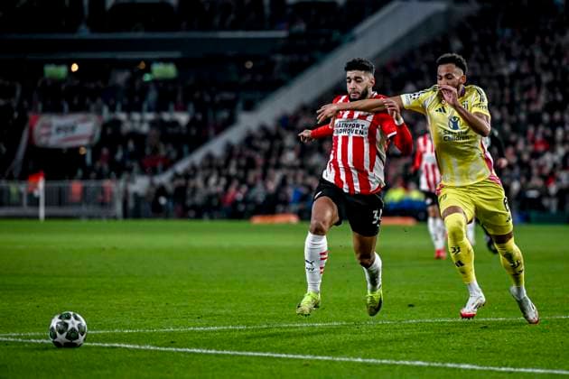 PSV midfielder Ismael Saibari, Juventus defender Lloyd Kelly, during the match PSV - Juventus at the Philips stadium for the UEFA Champions League - Knockout phase play-offs - 2nd leg season 2024-2025 in EINDHOVEN, Netherlands on 19 february 2025, (photo by Stefan Koops EYE4images DeFodi Images)