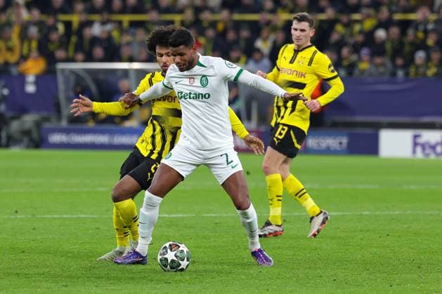 (250220) -- DORTMUND, Feb. 20, 2025 -- Karim Adeyemi(L) of Borussia Dortmund vies with Matheus Reis of Sporting CP during the UEFA Champions League knockout phase play-off second leg football match between Borussia Dortmund and Sporting CP in Dortmund, Germany, Feb. 19, 2025. (Photo by Xinhua) (SP)GERMANY-DORTMUND-FOOTBALL-UEFA CHAMPIONS LEAGUE-DORTMUND VS SPORTING CP JoachimxBywaletz 