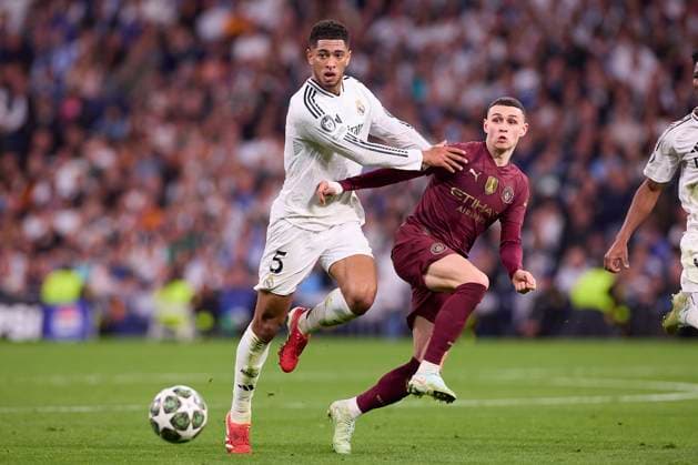 February 19, 2025, Madrid, Spain: Jude Bellingham (L) of Real Madrid CF and Phil Foden (R) of Manchester City seen in action during the 2024 2025 UEFA Champions League Knockout Play-off second leg match between Real Madrid CF and Manchester City at Santiago Bernabeu stadium. Final score Real Madrid CF 3 : 1 Manchester City Madrid Spain - ZUMAs197 20250219_aaa_s197_222 Copyright: xFedericoxTitonex